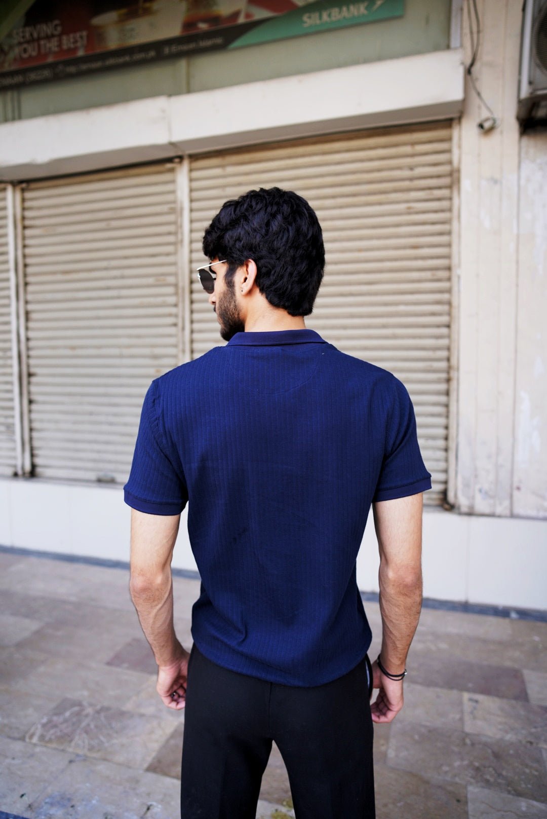 Men’s navy blue drop needle polo shirt – back view